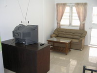 Pure Villa - Living room with sofa, television