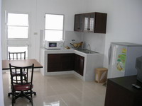 Pure Villa - Kitchen with microwave oven, electric thermo pot, dining table, dinng ware.