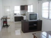 Pure Villa - Kitchen with microwave oven, electric thermo pot, dining table, dinng ware.